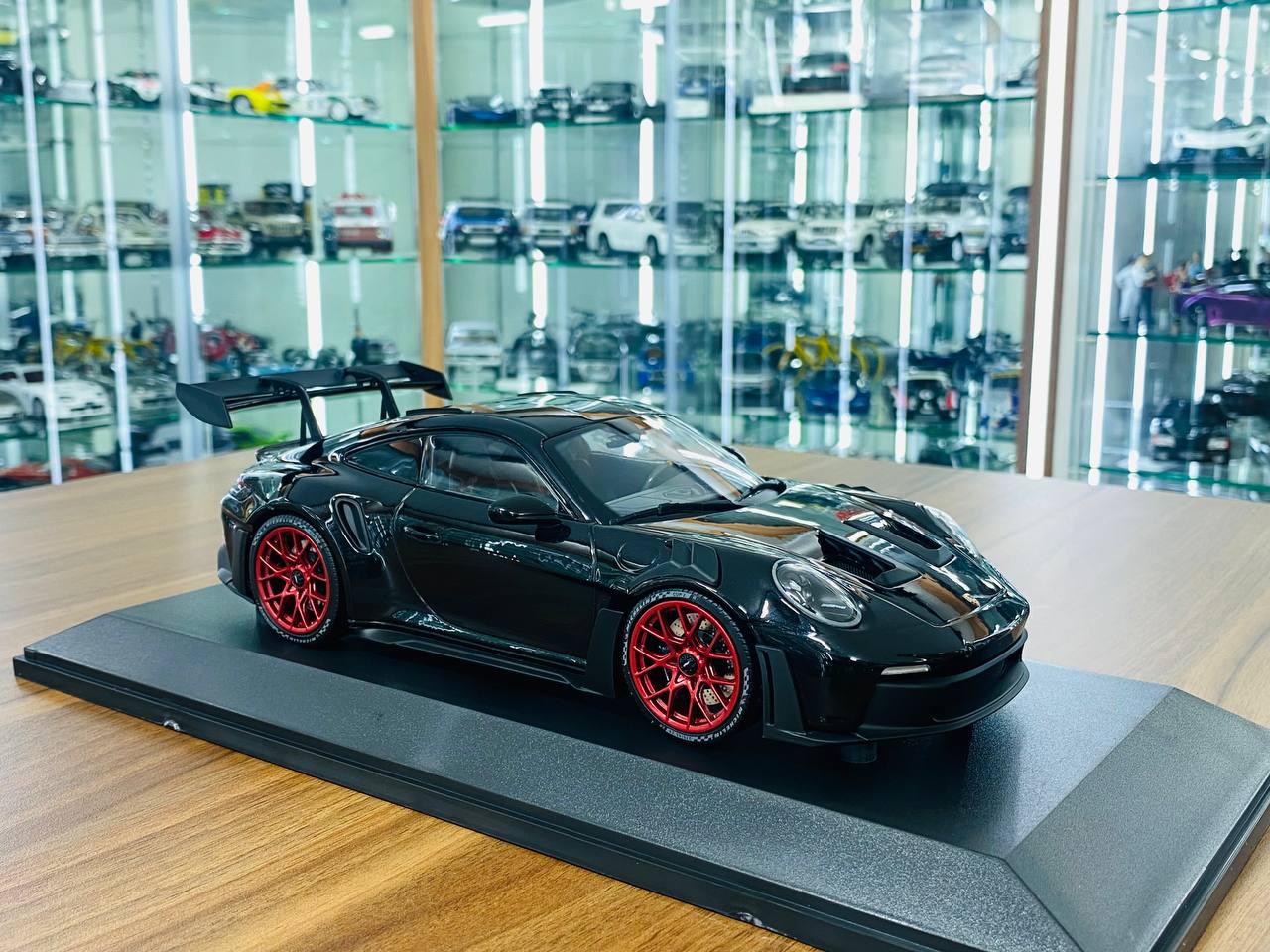 1/18 Diecast Minichamps Porsche 911 (992) GT3 RS 2023 in Black with Red Wheels