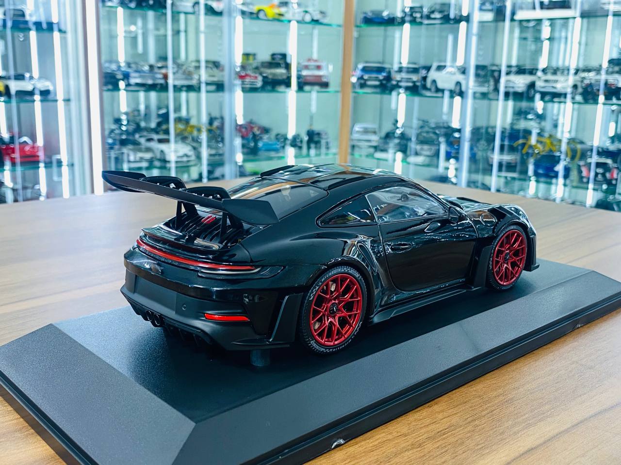 1/18 Diecast Minichamps Porsche 911 (992) GT3 RS 2023 in Black with Red Wheels