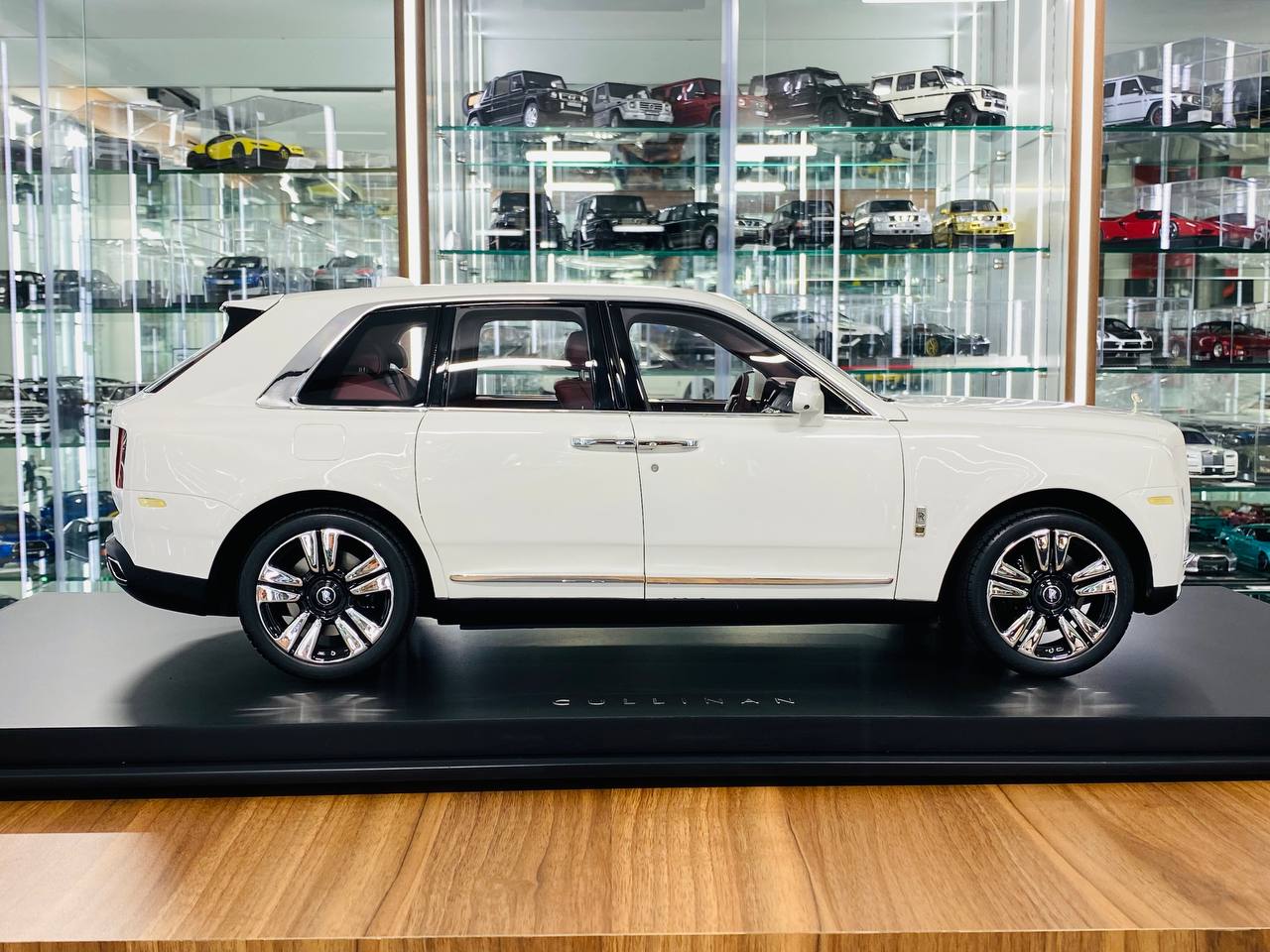 1/8 scale Amalgam Rolls-Royce Cullinan in a pristine white finish with luxurious maroon interior