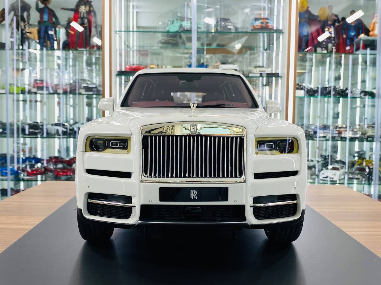 1/8 scale Amalgam Rolls-Royce Cullinan in a pristine white finish with luxurious maroon interior